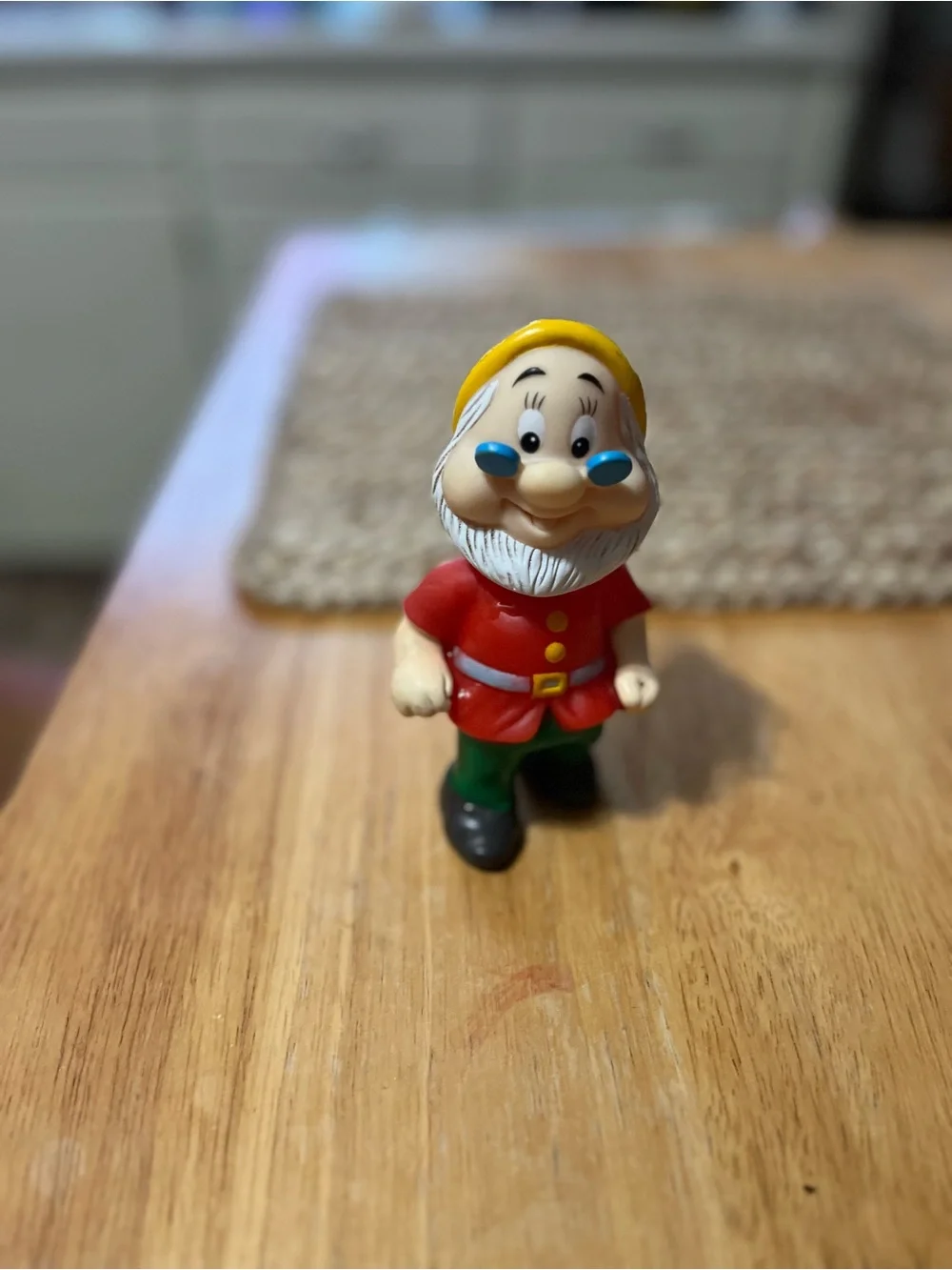 Disney Doc Figurine in Red Coat and Yellow Hat